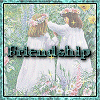 Two girls in white dresses with flower crowns hold hands in a field of flowers, with the word 'Friendship' overlaid in dark green text.