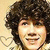 A pixelated image of a person with curly brown hair and light skin, next to text reading 'Future Mrs. Nick Jonas' on a black background.