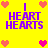 Yellow background with purple text 'I HEART HEARTS' and pink pixel hearts in four corners, with a central cluster of four hearts changing color from pink to red.