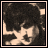 Animated contact sheet of a pixel art icon showing text evolution from "I wdnt d lover..." to "I dont hdue to love." with red letter highlights and a grayscale portrait in the top-left corner.