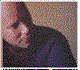 Three distinct pixelated portrait views of a person with dark hair, each in a separate frame showing different angles and expressions against varied backgrounds.