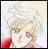 Pixelated static image of a person with light hair and red clothing against a light background.