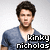 Pixelated image of a person with dark hair wearing a blue V-neck shirt against light background, text overlay reads 'kinky nicholas' in blocky font.