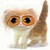 Pixelated image of a light brown and white cat with large orange eyes, sitting upright with tail raised against a plain white background.