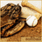 Pixelated image of a softball on a wooden surface with a white base, red text reading "softball is life!" and "OMGAA storm u12 crimson #9" below.