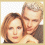 Two pixelated figures in close proximity, one with light brown hair and the other with short gray hair, positioned side-by-side against a white background.