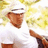 Pixelated image of a person in white clothing holding an object, with text 'heidi', 'loves', and 'kenny chesney' on green background.