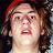 Pixelated static image of a person with long dark hair wearing a red headband, visible in 256x256 resolution.