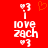 Red background with white pixelated text 'I love zach' and heart symbols, featuring an orange heart animation in the top center.