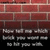 A static image of a red brick wall with a dark baseboard and black background, featuring multiple pixelated white and gray shapes resembling abstract or stylized text fragments.