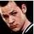 Pixelated image of a person with short dark hair wearing a black and white striped collar, next to bold text reading "I LOVE GC" on a white background.