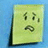 A pixelated yellow-green square icon with a sad face expression on a blue background.