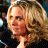 A 48x48 pixel buddy icon split into two frames showing a woman with curly blonde hair on the left and "Scooby Doo 2" text on a blue background on the right.