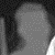 Two grayscale pixelated figures with rounded heads and vertical bodies stand side-by-side against a dark background, their forms composed of light gray dots on darker gray fields.