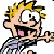 Pixelated cartoon character with spiky yellow hair, black shirt, blue pants, and pink tongue sticking out in a wide open mouth expression, holding an object in right hand against white background.