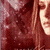 A pixelated image of a person with long brown hair in a red-toned color scheme, showing multiple overlapping views of the face and hair.