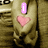 A hand holds a pink heart with a small 'i' icon above it, then the 'i' disappears while the heart remains.