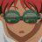 A 48x48 pixel animated buddy icon featuring a character with red hair and green sunglasses on the left, paired with "Anime IM" text in white pixelated font on black background on the right.