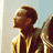Animated contact sheet showing three frames of John Legend's profile with text "JOHN LEGEND" on a beige background, displaying motion blur and color variations across frames.