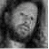 A sequence of four grayscale frames showing a person's face with increasing brightness and pixelation, transitioning to color in later frames.