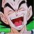 Pixelated close-up of a character with spiky hair, wide eyes, and an open mouth showing teeth and tongue against a green background.