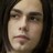 Static pixelated image of a person's face with dark hair, neutral expression, and light skin tone.