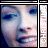Pixelated face with blue eyes and light skin, framed by vertical text reading 'CHRISTINA' on both sides.