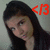 Pixelated image of a person with long dark hair, light skin, and a neutral expression, with red text '<3' in the upper right corner against a gray background.