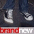 Static pixelated icon showing a partial view of white sneakers on dark fabric with red and white text at the bottom.