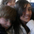 Two people embrace in a pixelated photo on the left, with blue text reading "Jacey & Brock ily :]" on a black background to the right.