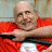 A contact sheet of two animated frames showing a person in an orange jumpsuit holding a black object and a red box with 'ARRESTED DEVELOPMENT' text above it.