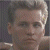 A pixelated image split into two sections: a grayscale portrait on the left and green text on a dark background on the right.