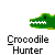 Green crocodile head with white teeth, orange hand holding a white ball, and red splatter on the crocodile's face.