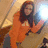 A pixelated image shows a person in an orange jacket holding a laptop, with text on the right reading "This is why I'm HOT!" against a pink background.