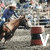 A rodeo scene with a rider on a bucking horse, repeated across a with visible text letters forming "VALLEY"