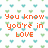 Pixelated text on a patterned background with green and blue heart shapes, orange lettering reading "You know you're in LOVE when all u can THINK about is HIM!".