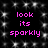 Black background with white sparkles and pink text reading 'look its sparkly' in two identical vertical