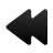 Black arrow-shaped icon pointing left with rounded edges and a gradient fill, set against a light gray background.