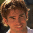 A 48x48 pixel buddy icon split into two frames showing a person with brown hair and a green background with text, part of an animated contact sheet.