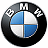 Circular black-and-white logo with blue quadrants, featuring a stylized 'BMW' text above the central emblem.