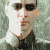 Six -aligned show a person in dark sunglasses and black clothing against a textured gray background, with varying lighting across the frames