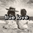 Two figures sit on a beach with text overlay; one figure wears a hat and white dress, the other has short hair. The scene shifts from grayscale to sepia tones.
