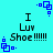 Cyan background with black text reading "I Luv Shoe!!!!!" and blue pixelated square patterns in four corners.