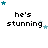 Pixelated text 'he's stunning' with teal and light blue stars arranged in a circular pattern above the text, displayed