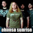 A pixelated image shows a group of people with one central figure in a green shirt, surrounded by others in dark clothing, with text overlays reading "the poster and the monarch" and "franksicons".