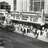 Pixelated grayscale image of a theater interior with rows of seats and a stage area, appearing as a low-resolution thumbnail.