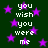 Dark green background with scattered purple stars and repeated white pixelated text reading 'you wish you were me' in a pattern