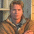 A pixelated image shows a person in a brown jacket with a high collar against an indoor background, next to green text reading 'Original Icons .com' on a dark green backdrop.