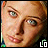 A pixelated close-up of a person's face with subtle expression changes , featuring light brown hair and visible eyes