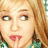 A pixelated image of a person with light brown hair and a green plaid shirt, with the text 'my idol' overlaid on the right side.